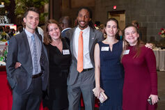 A group of smiling IU alumni at a special event.